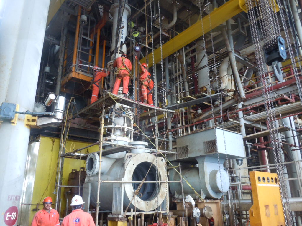 Field team inspecting process lines and equipment interfaces